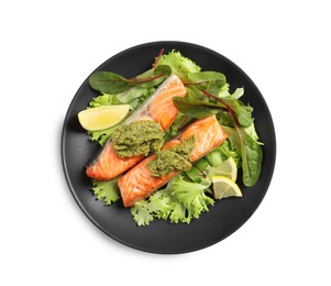 Photo of Tasty cooked salmon with pesto on white background, top view