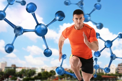 Image of Metabolism concept. Molecular chain illustration and athletic young man running outdoors on sunny day 