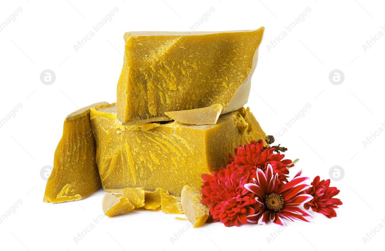 Photo of Natural organic beeswax blocks and flowers on white background