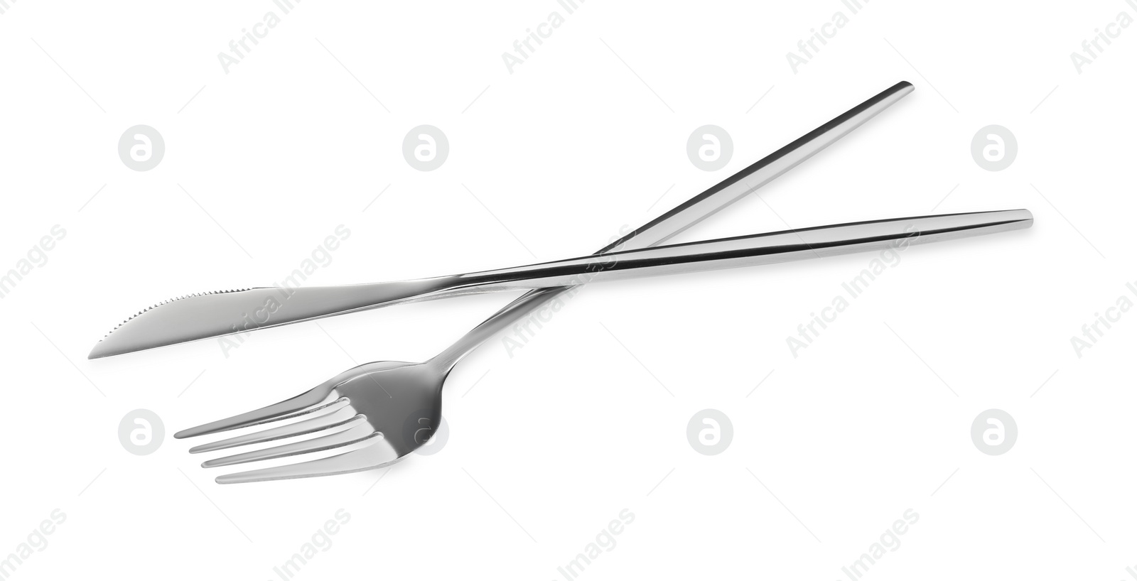 Photo of Fork and knife isolated on white. Stylish shiny cutlery set