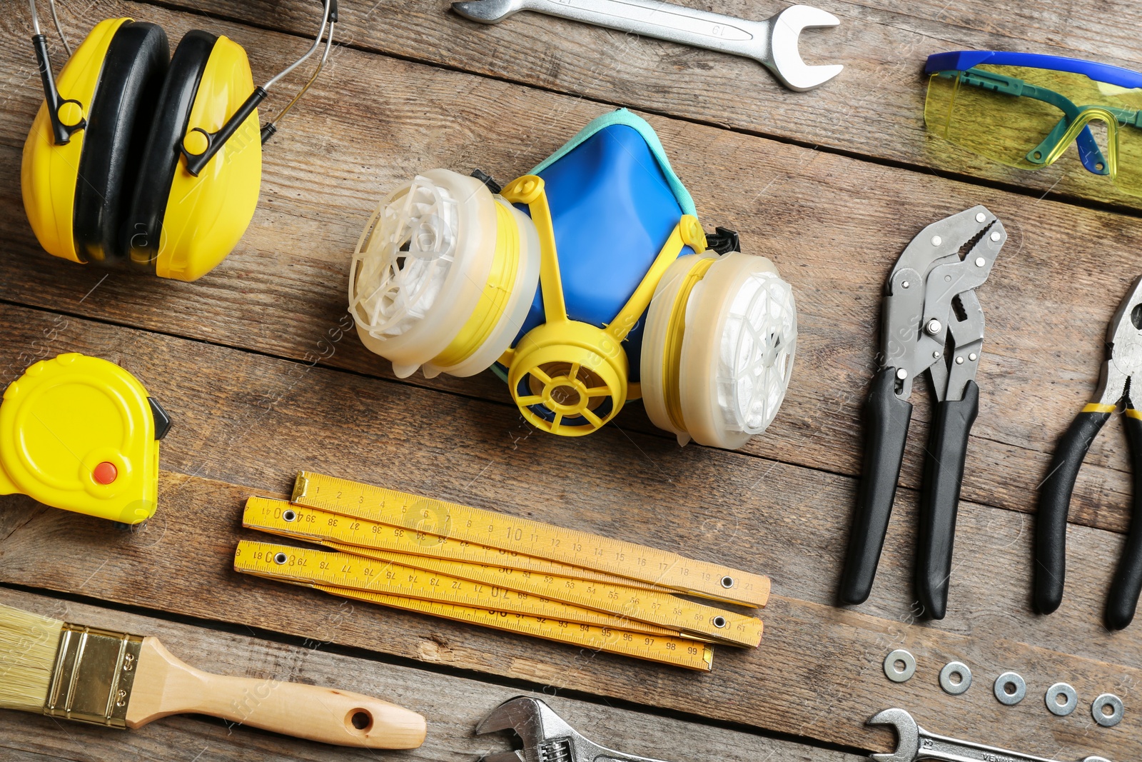 Photo of Flat lay composition with construction tools on wooden background