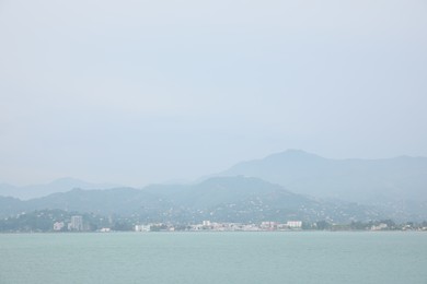 Beautiful landscape with city on shore, view from sea