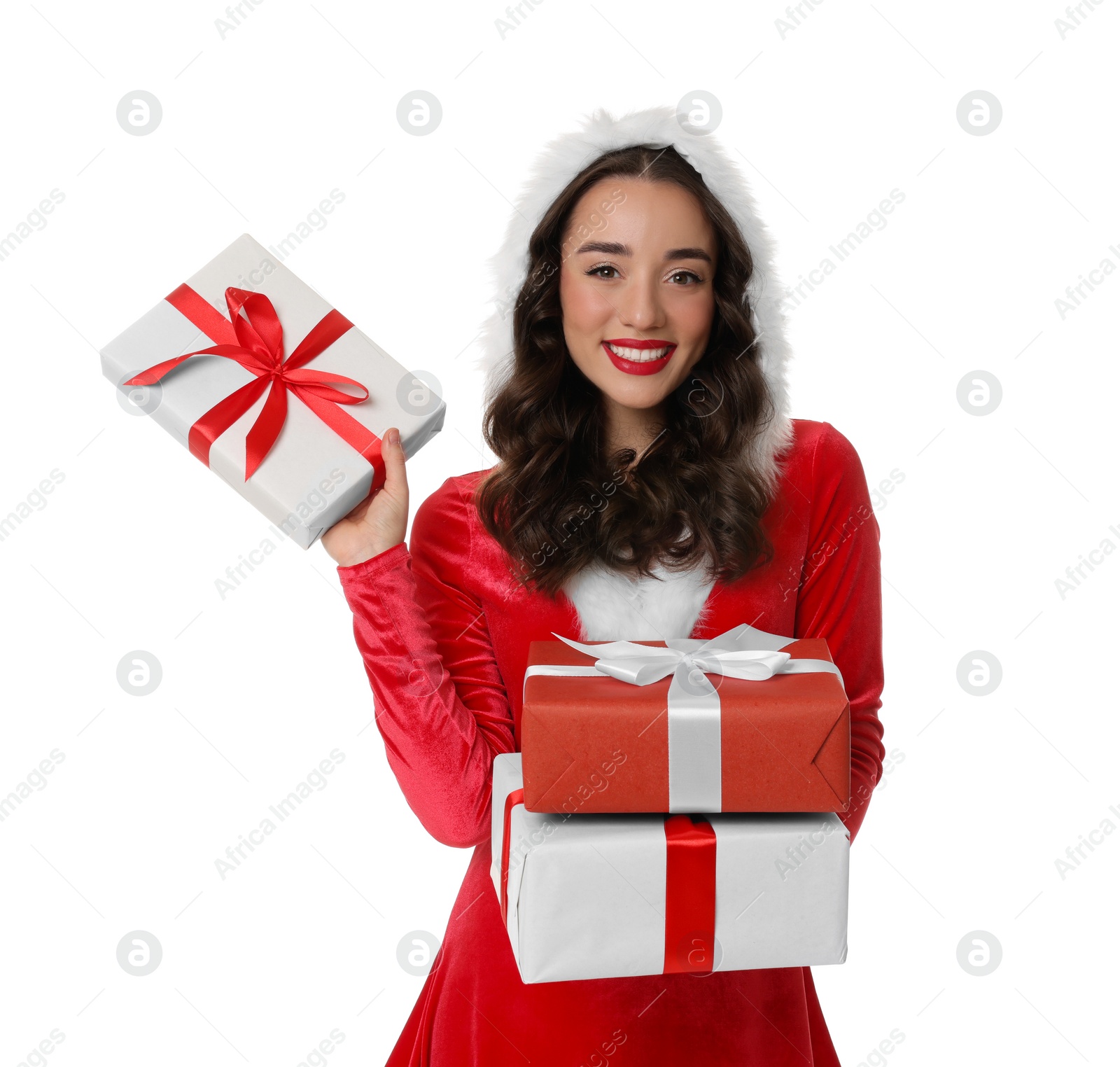 Photo of Beautiful young woman in Christmas red dress holding gift boxes isolated on white