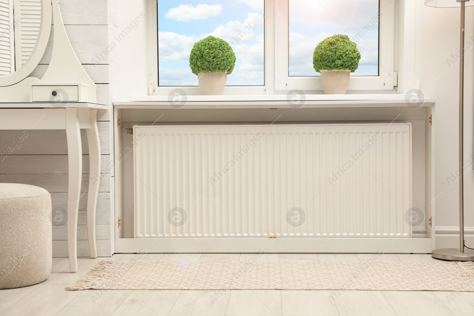 Photo of Modern radiator at home. Central heating system