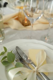 Photo of Festive table setting with beautiful floral decor, closeup