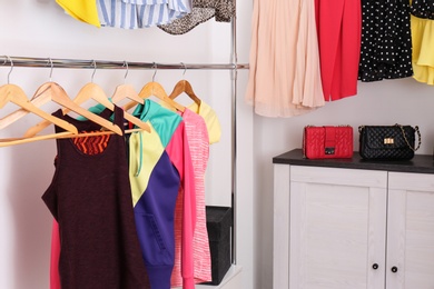 Modern dressing room with different stylish clothes and accessories