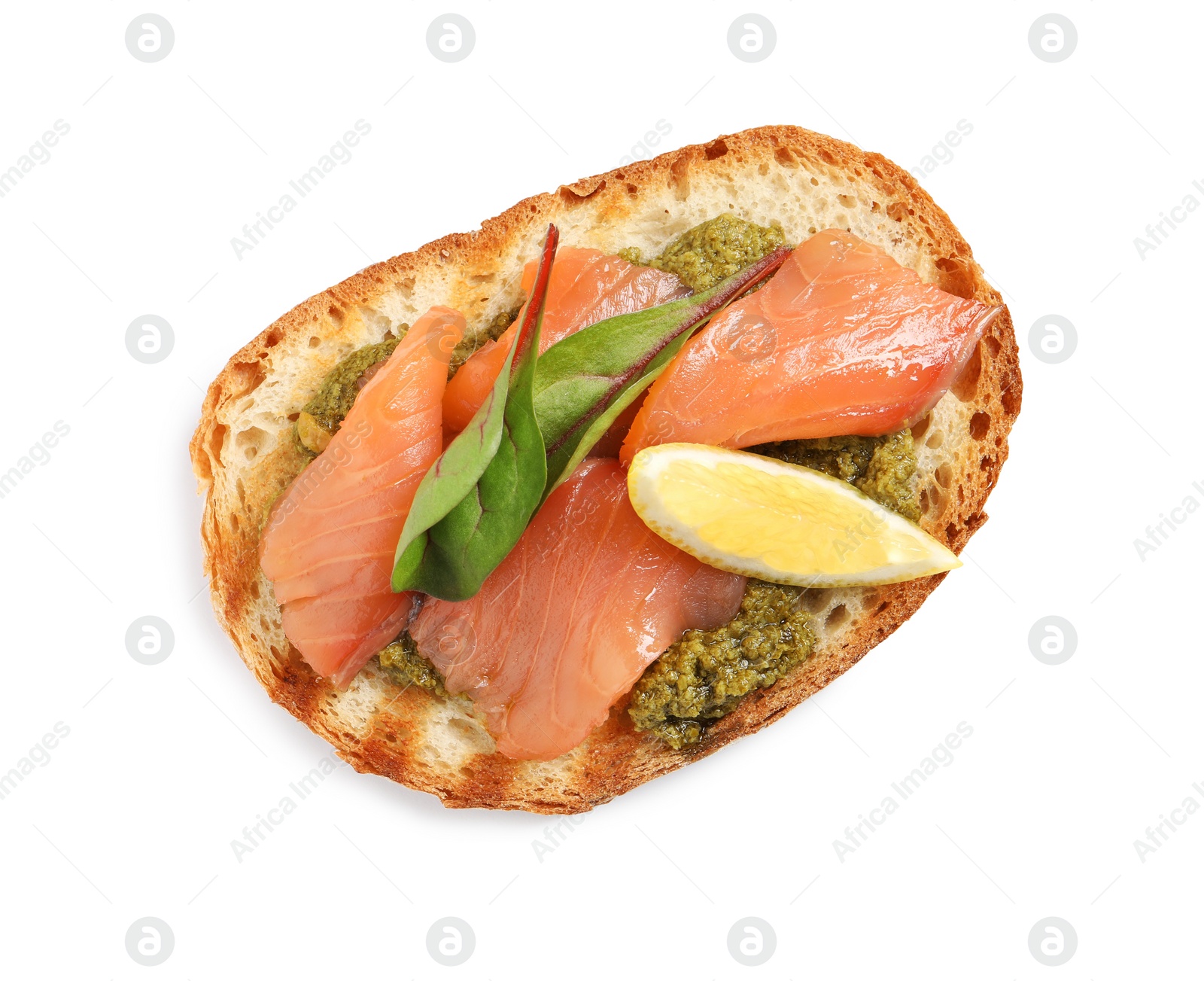 Photo of Delicious bruschetta with salmon and pesto sauce on white background, top view