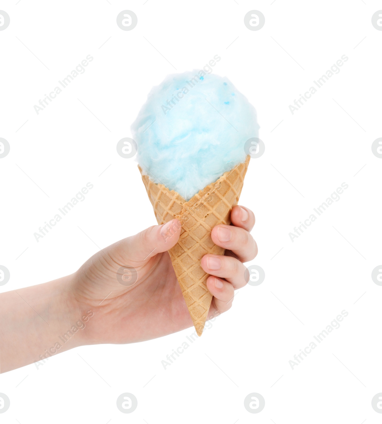 Photo of Woman holding waffle cone with cotton candy on white background, closeup