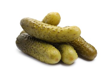 Photo of Pile of tasty pickled cucumbers isolated on white