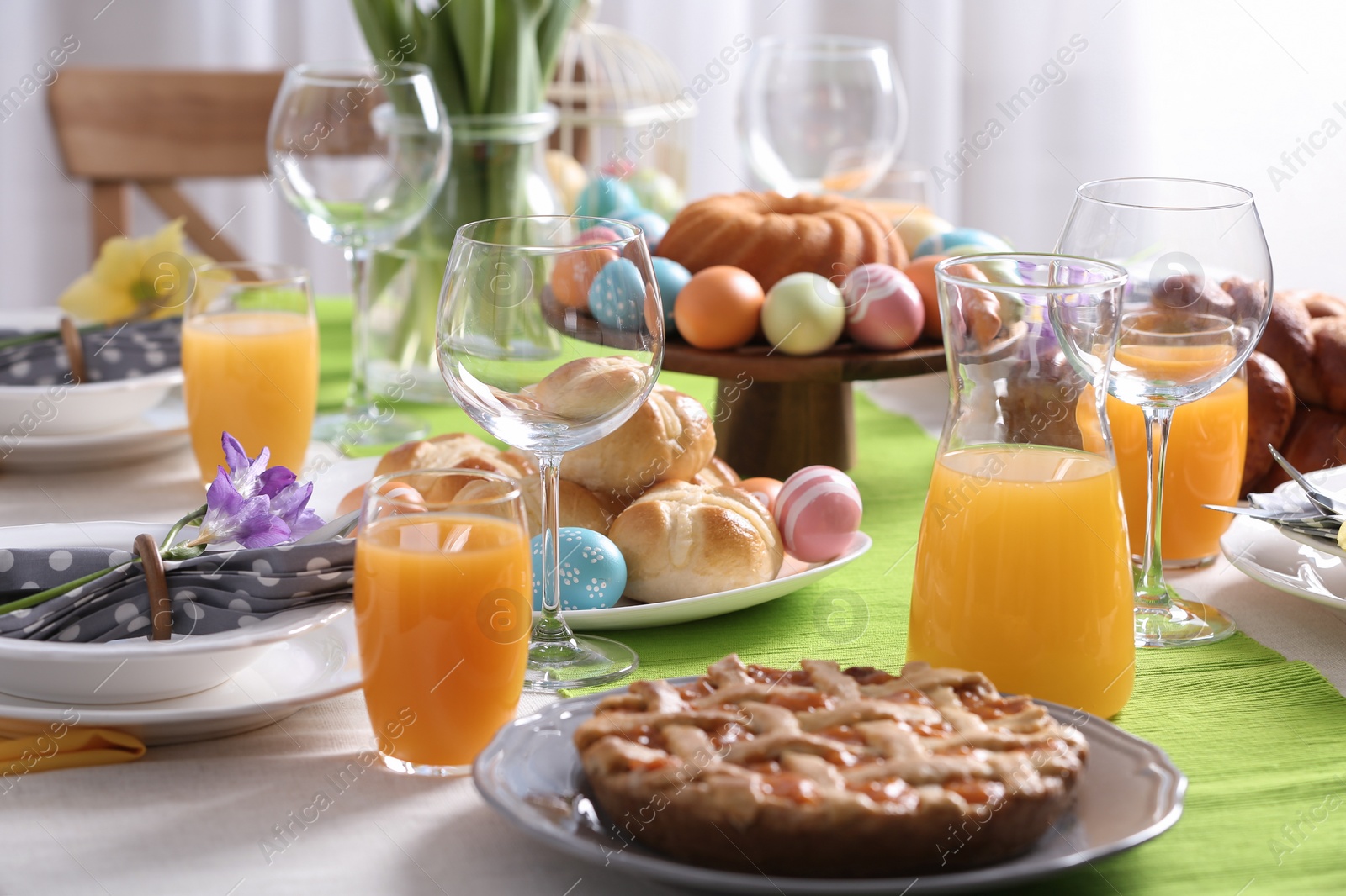 Photo of Festive Easter table setting with traditional meal at home