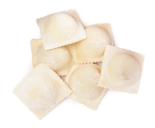 Photo of Uncooked ravioli with filling on white background, top view
