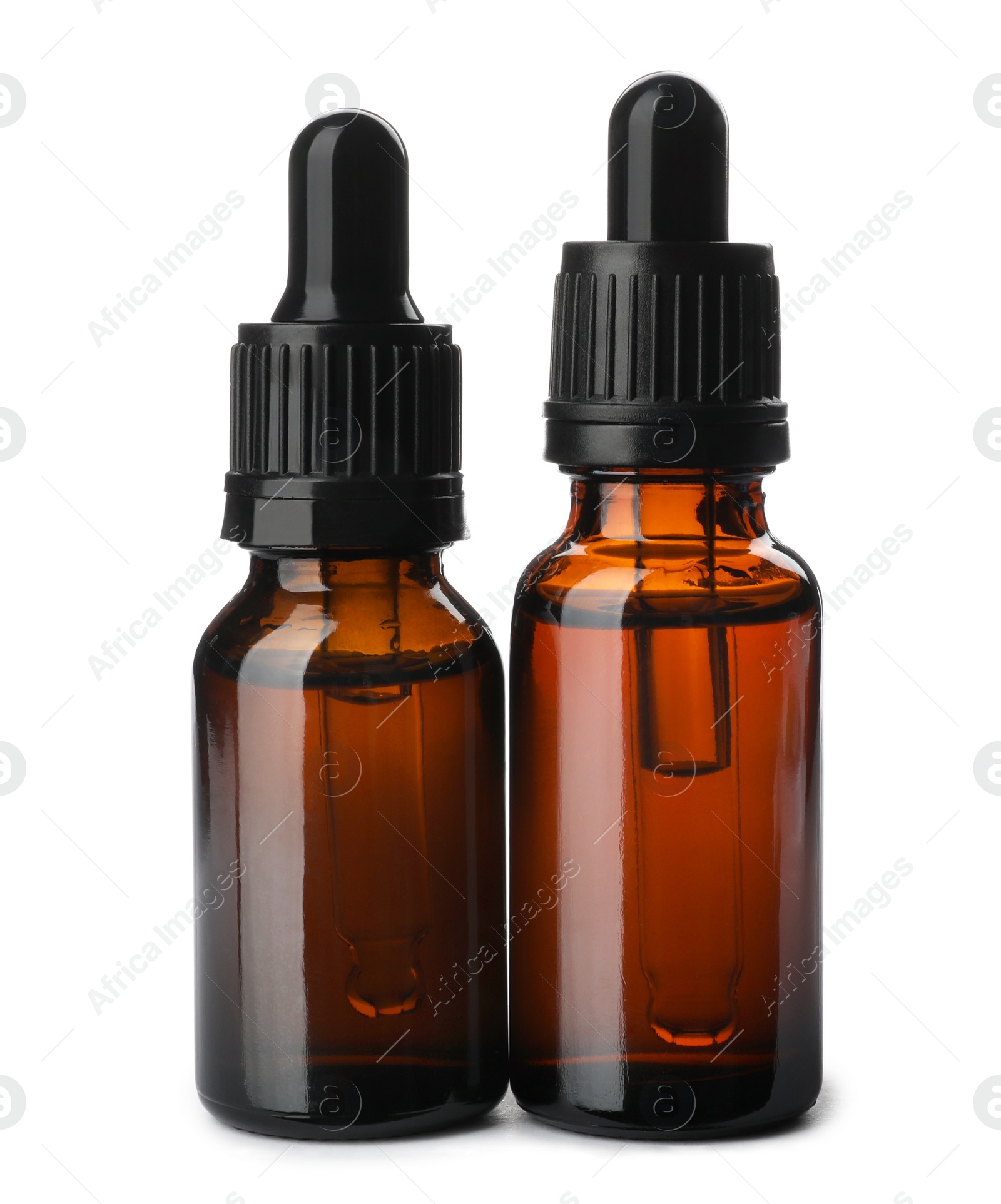 Photo of Bottles of essential oil isolated on white