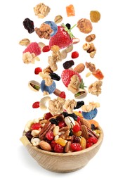 Image of Delicious granola, nuts and berries falling into bowl on white background. Healthy snack 