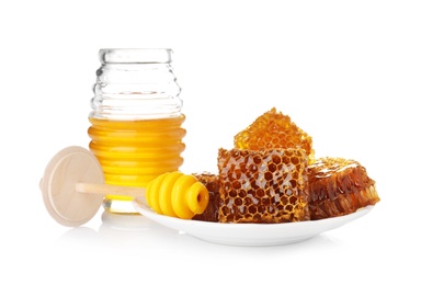 Photo of Composition with jar of honey on white background