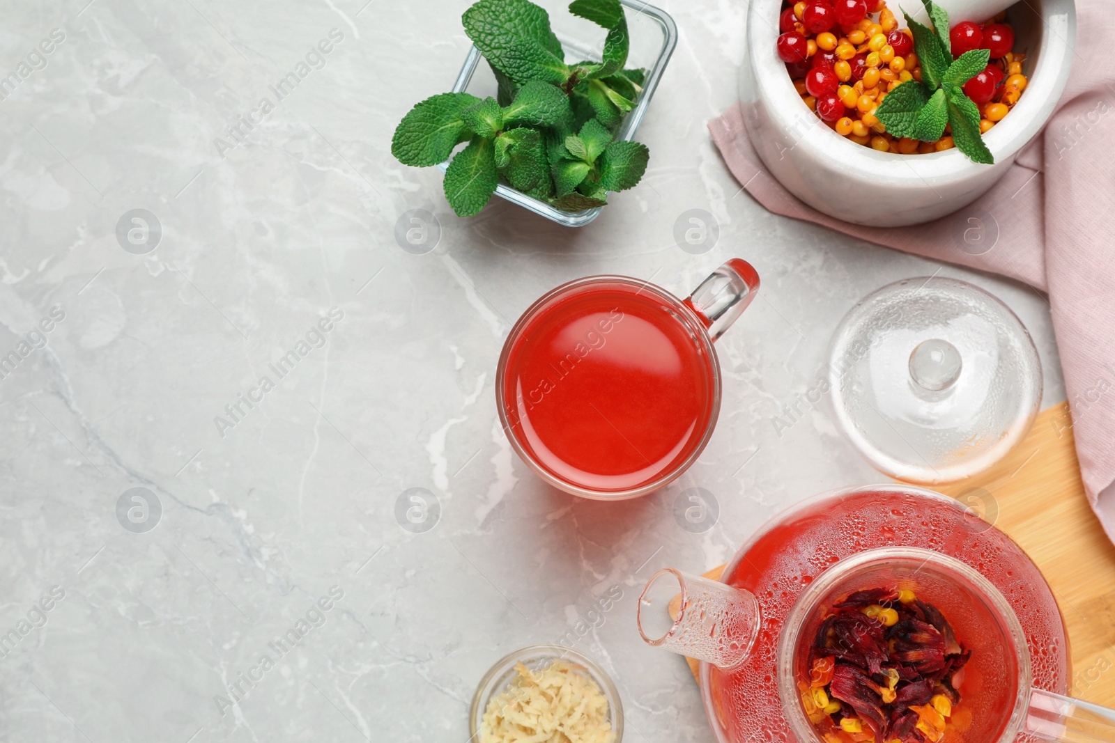 Photo of Flat lay composition with immunity boosting drink on light grey marble table. Space for text