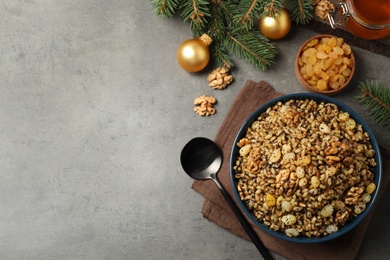 Photo of Traditional Christmas slavic dish kutia served on grey table, flat lay. Space for text