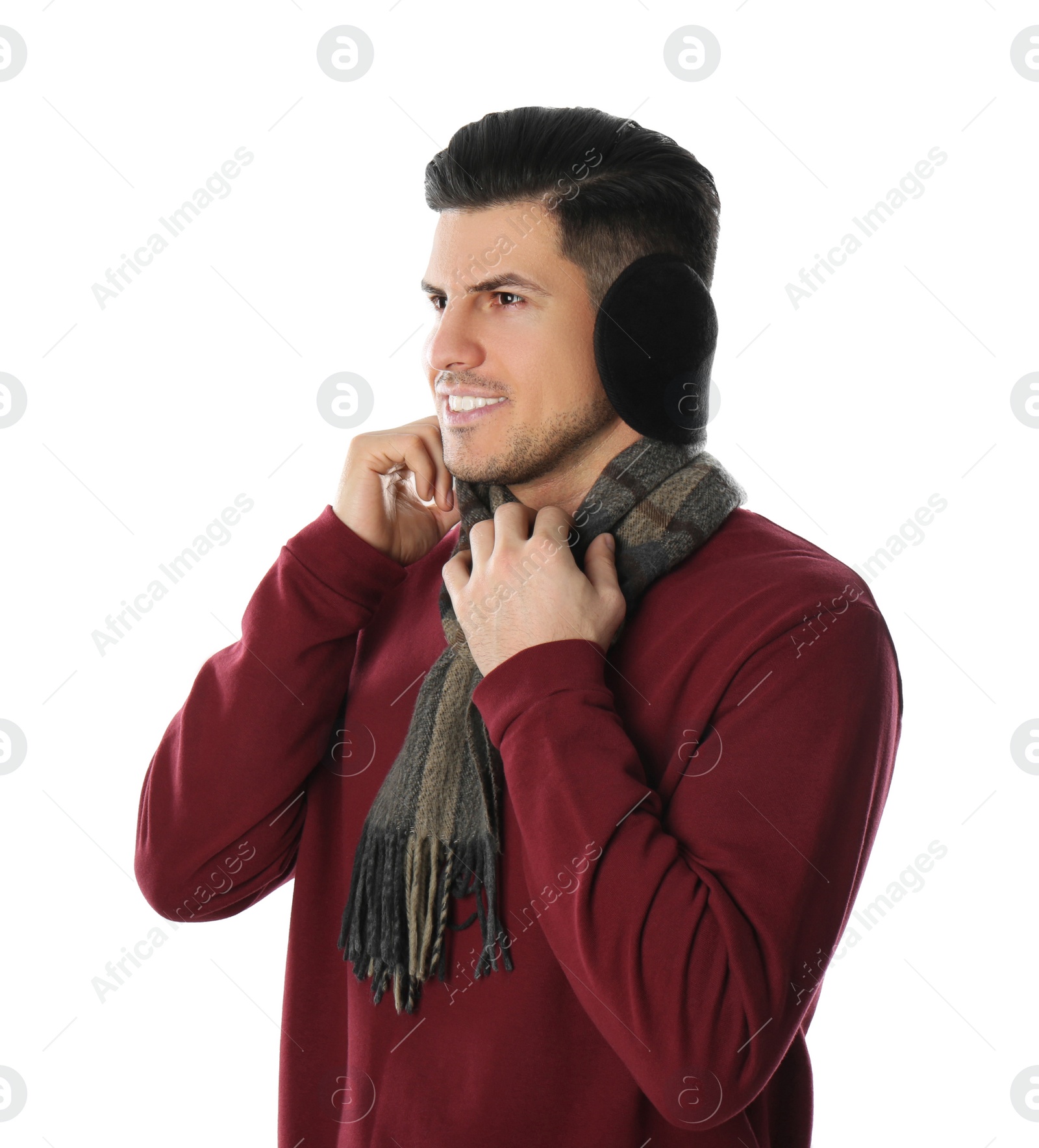 Photo of Man wearing stylish earmuffs and scarf on white background