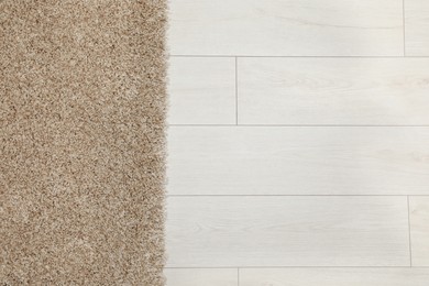 Photo of Beautiful beige carpet on floor, top view. Space for text