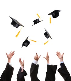 Group of graduates throwing hats against white background, closeup