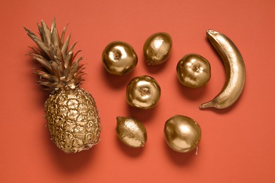 Photo of Different golden fruits on color background, flat lay