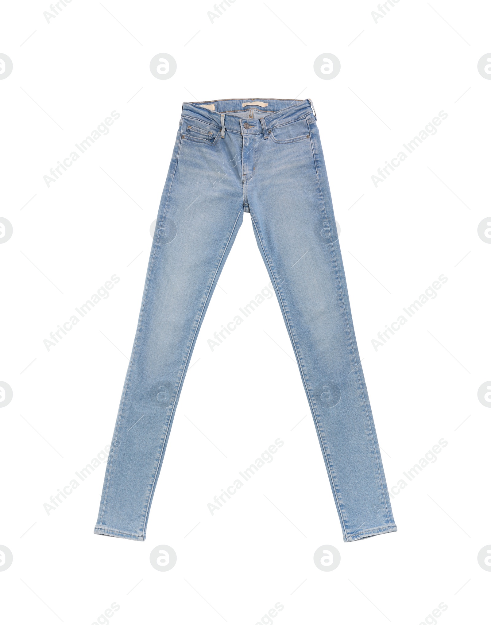 Photo of Stylish light blue jeans isolated on white, top view