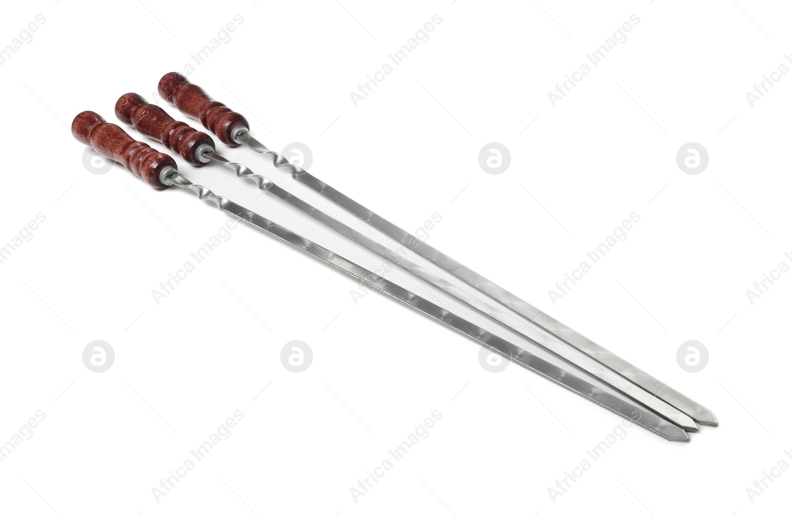 Photo of Metal skewers with wooden handle on white background