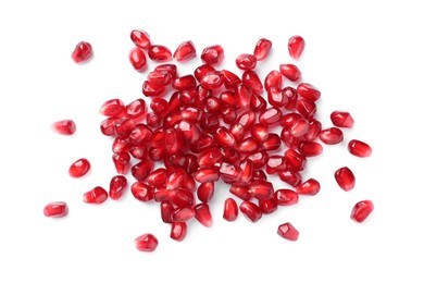 Photo of Tasty pomegranate seeds on white background, top view