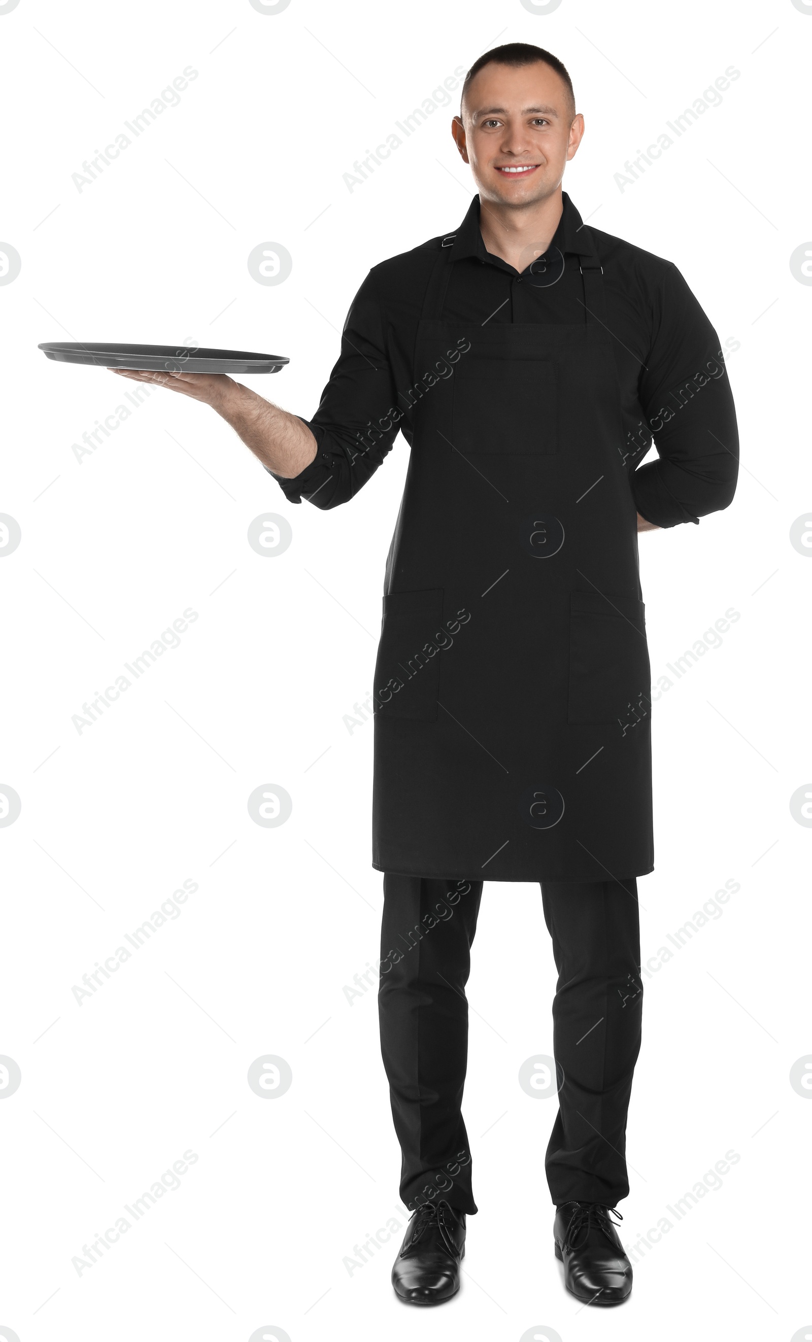 Photo of Full length portrait of happy young waiter with tray on white background