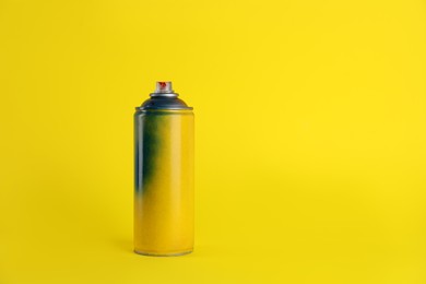 Used can of spray paint on yellow background. Space for text