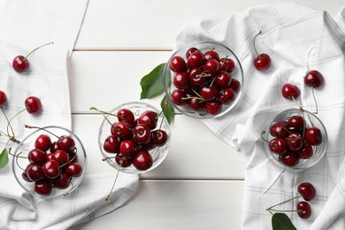 Photo of Sweet red cherries on white wooden table, flat lay