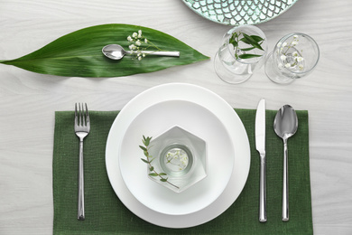 Photo of Elegant festive setting on white wooden table, flat lay