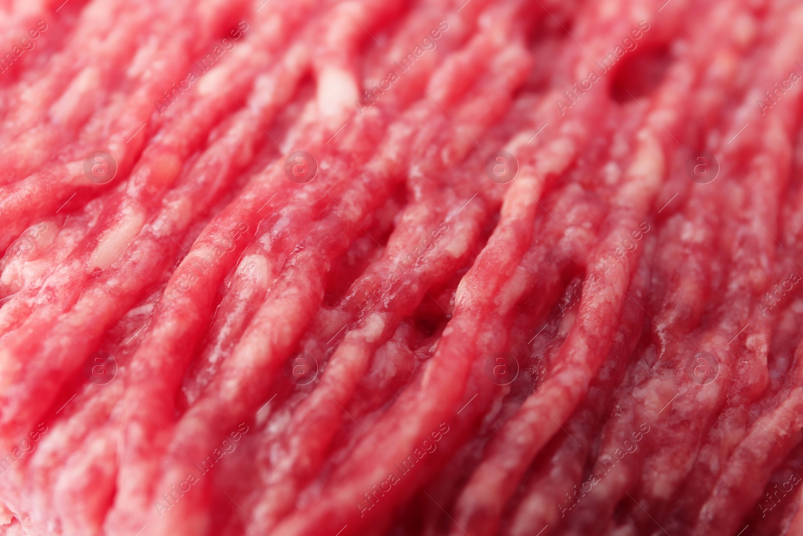 Photo of Fresh raw minced meat as background, closeup