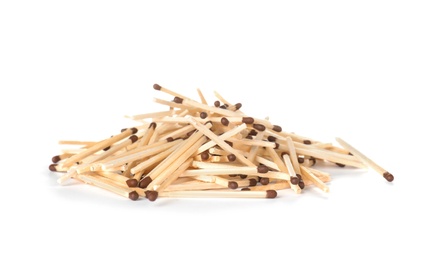 Pile of wooden matches on white background