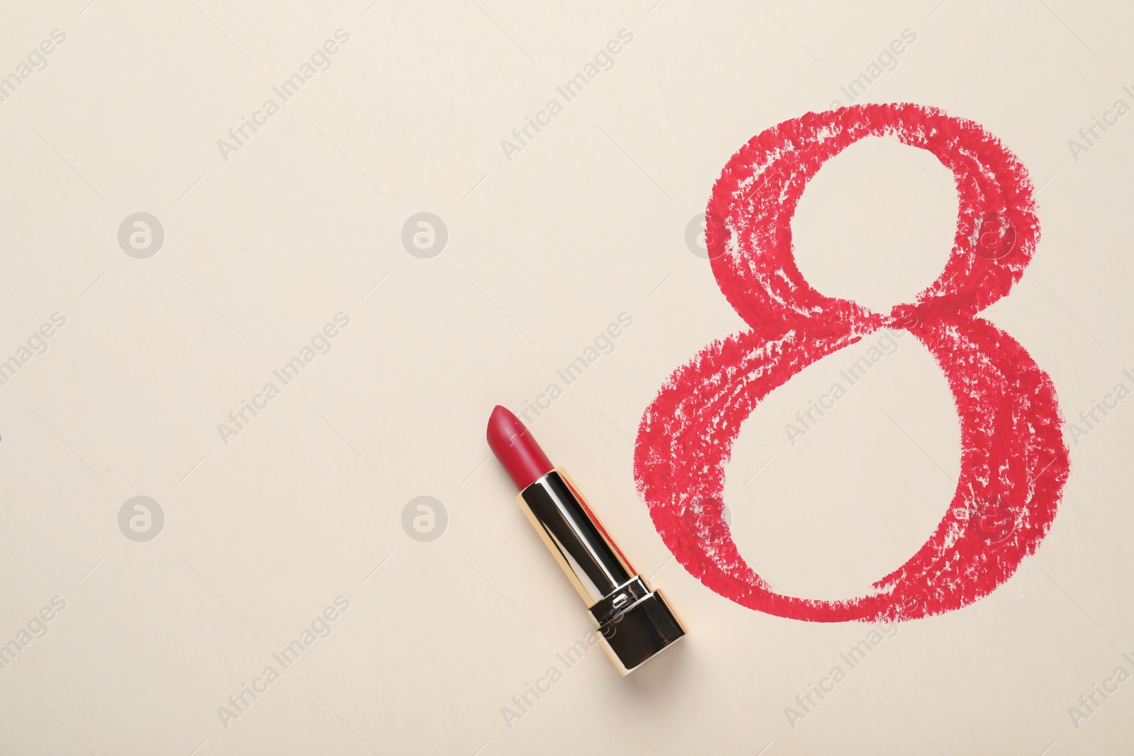 Photo of 8 March greeting card design with lipstick and space for text on light background, top view. International Women's day