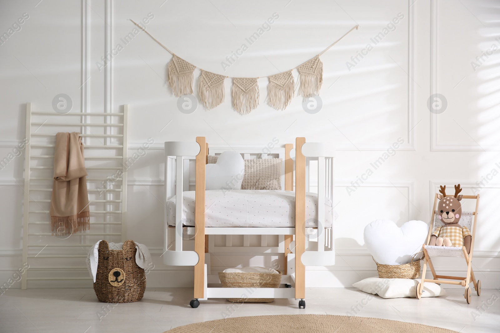 Photo of Baby room interior with stylish furniture and toys