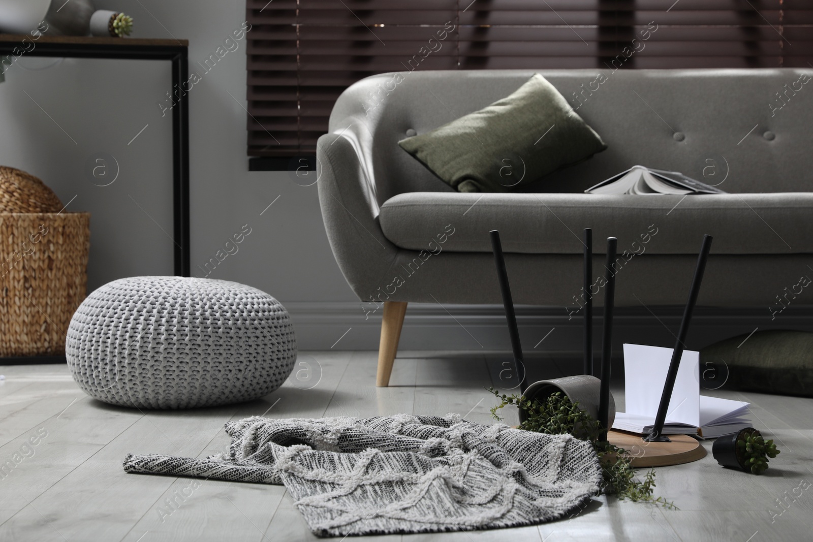 Photo of Chaotic living room interior after strong earthquake