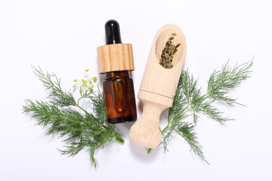 Bottle of essential oil and scoop with fresh dill on white background, flat lay