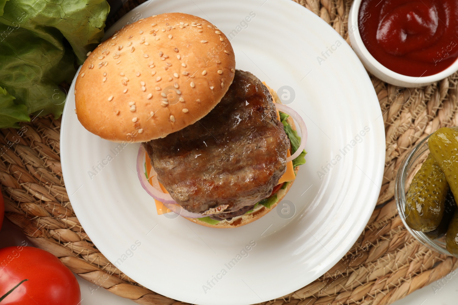 Photo of Tasty hamburger with patties, cheese and vegetables served on table, flat lay