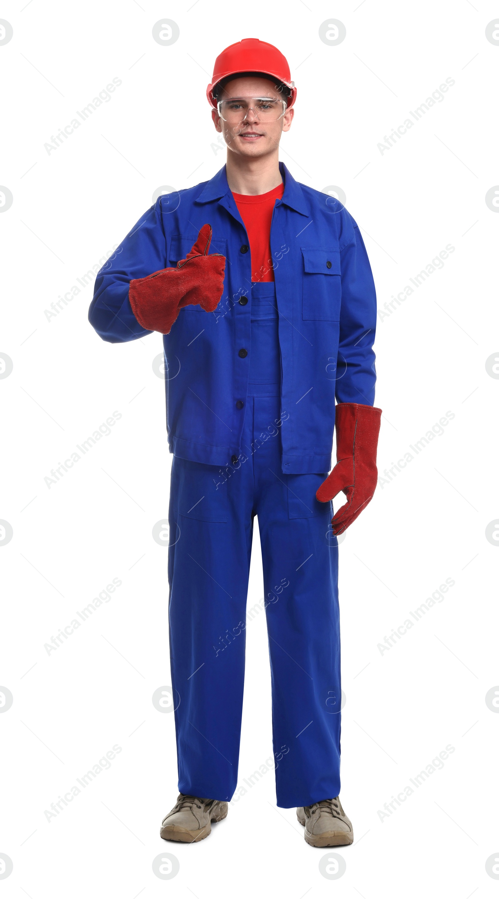 Photo of Young man wearing safety equipment and showing thumbs up on white background