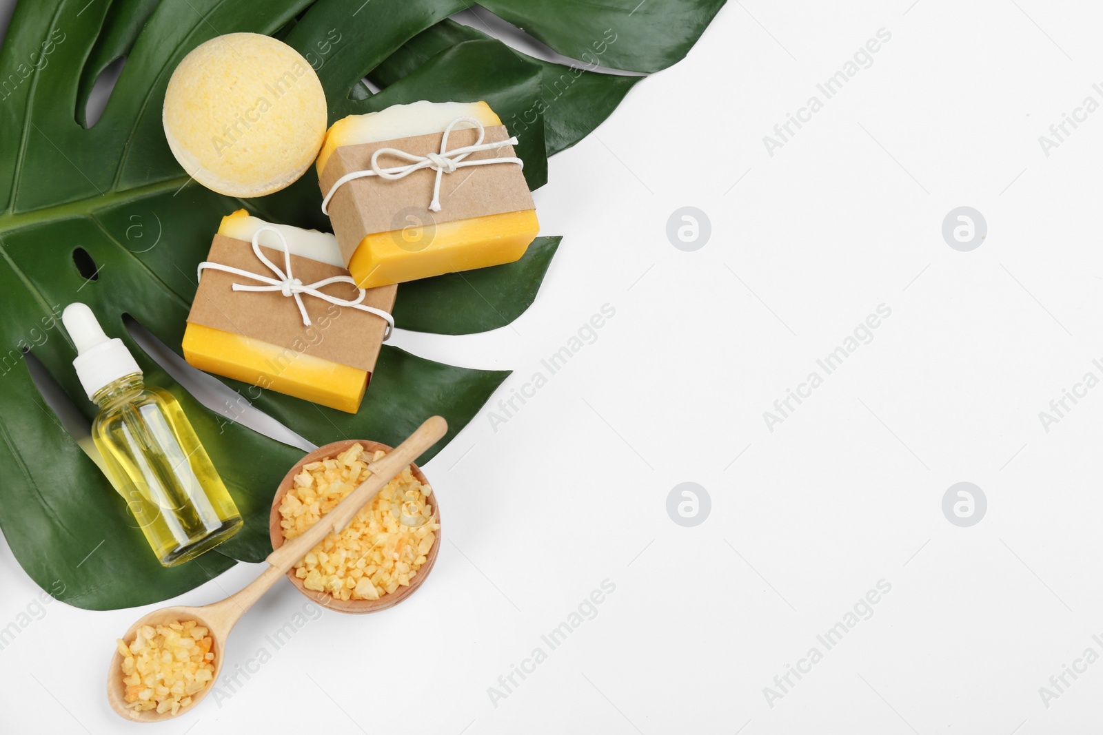 Photo of Natural handmade soap and ingredients on white background, top view