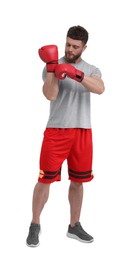 Photo of Man putting on boxing gloves against white background