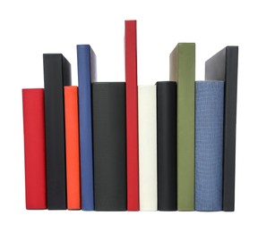 Photo of Many different hardcover books on white background