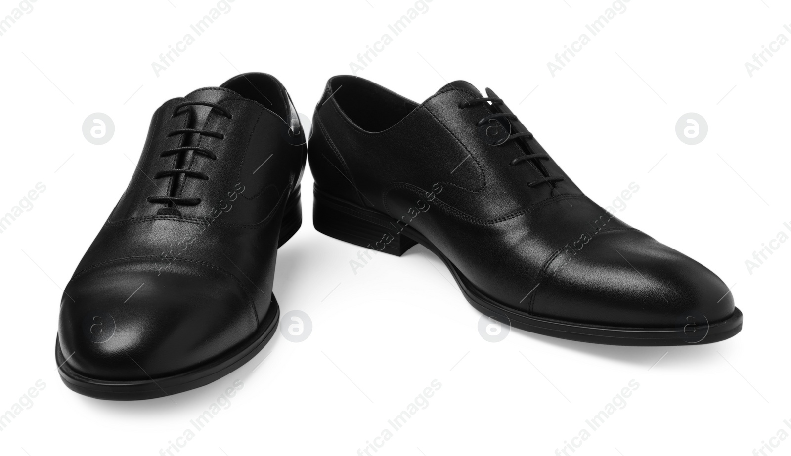 Photo of Pair of black leather men shoes isolated on white