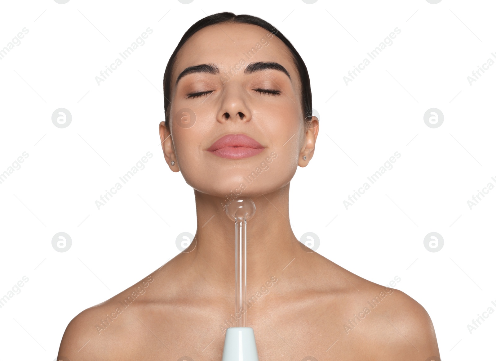 Photo of Woman using high frequency darsonval device on white background