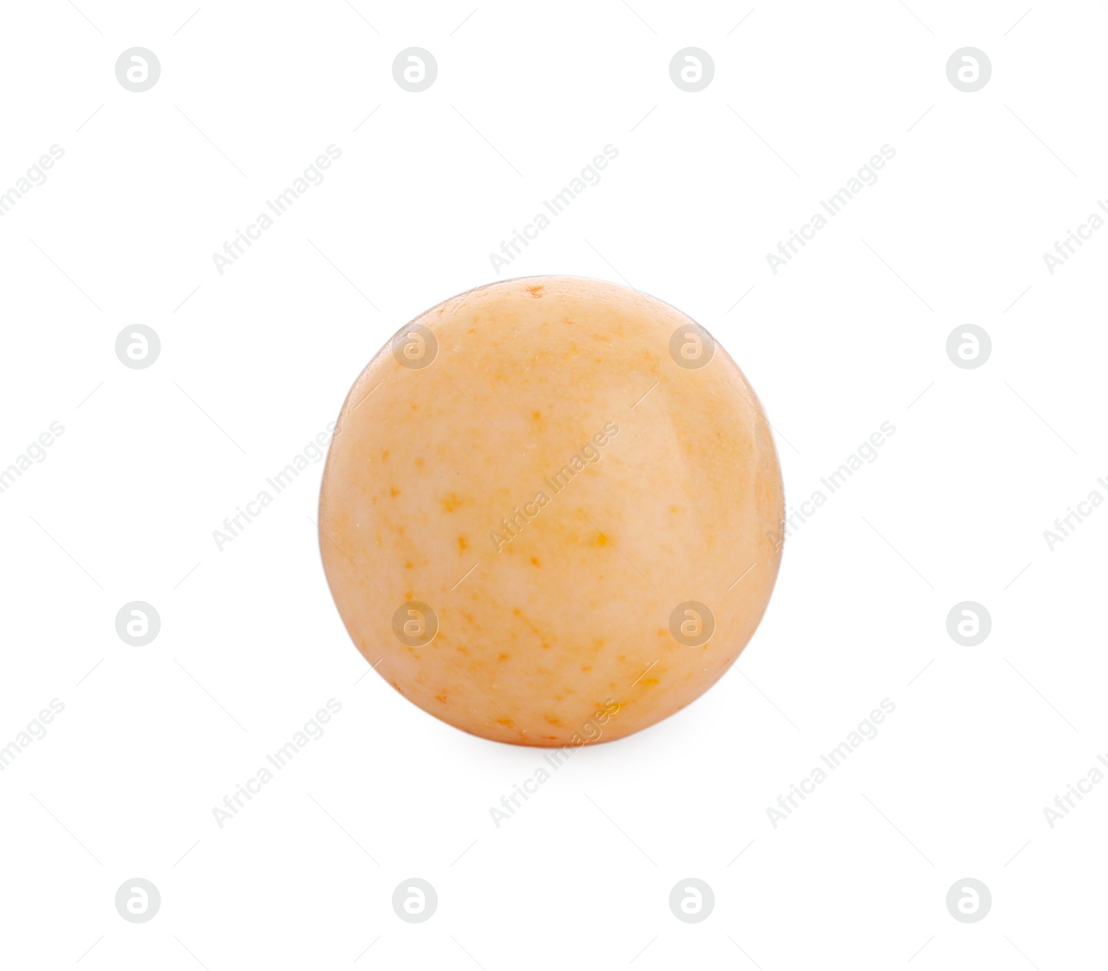 Photo of One bright orange gumball isolated on white