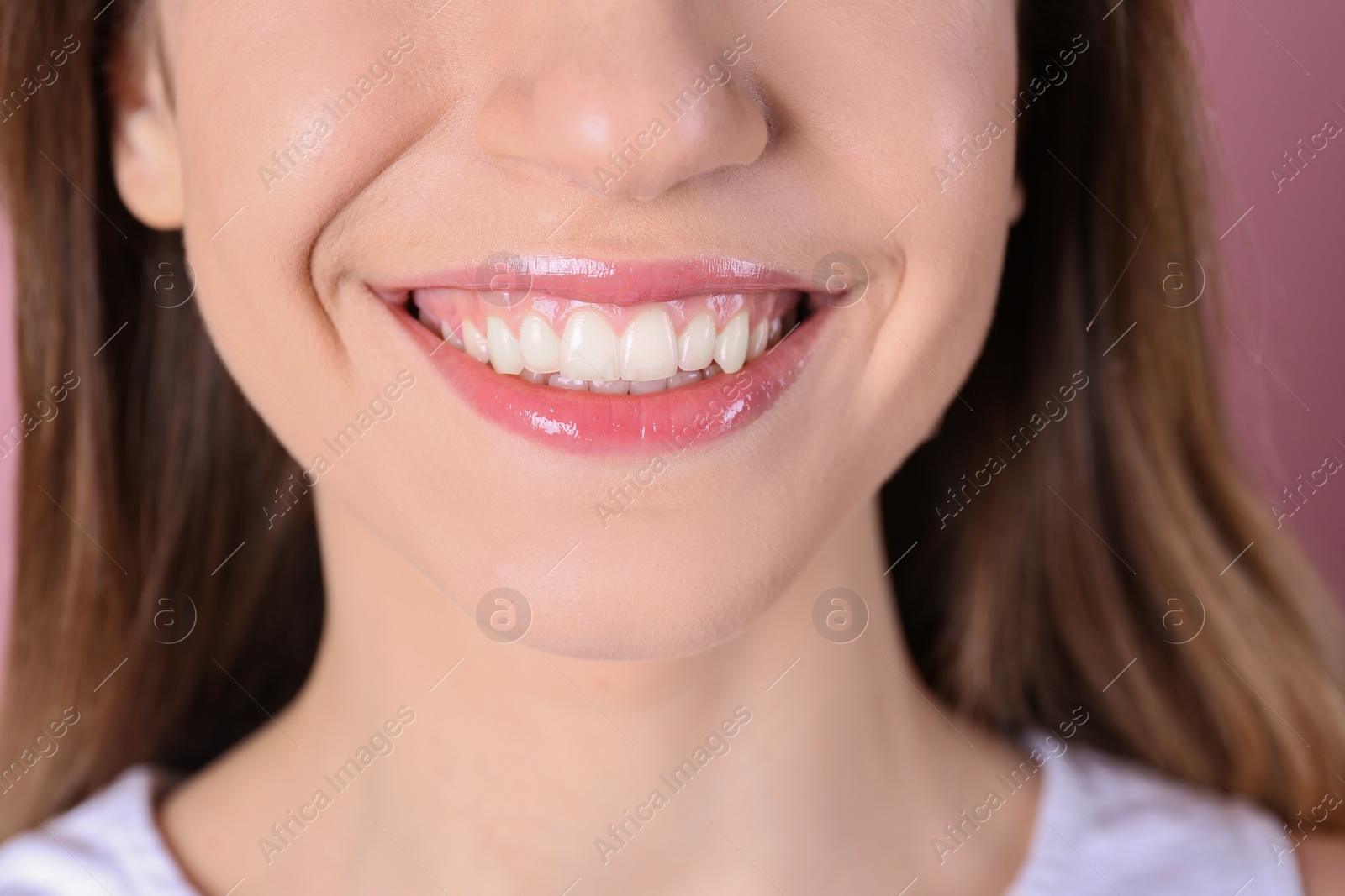 Photo of Young woman with beautiful smile, closeup. Healthy teeth