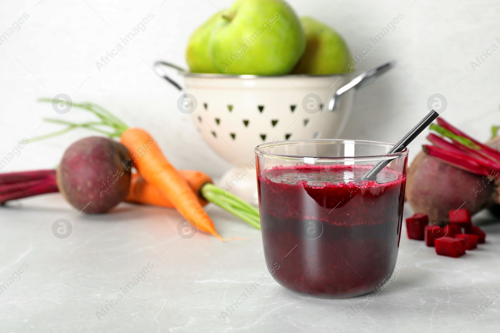 Photo of Glass of fresh beet juice on table