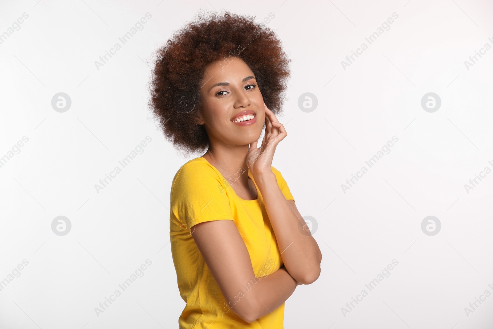 Photo of Portrait of beautiful young woman with glamorous makeup on white background