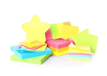 Photo of Pile of different colorful sticky notes on white background. School stationery