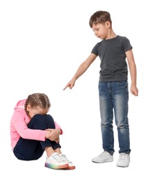 Boy pointing at upset girl on white background. Children's bullying